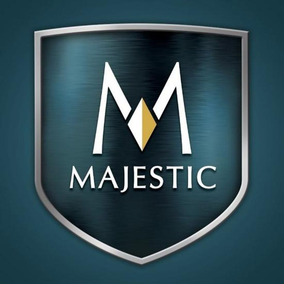 Majestic logo on a shield-shaped emblem with a stylized 'M' in gold and white over a dark background, symbolizing premium fireplace solutions