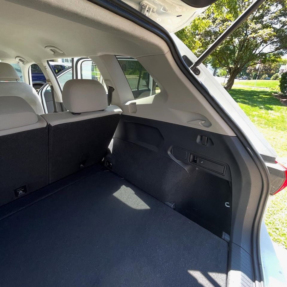 Freshly vacuumed SUV cargo floor and side panels after an interior cleaning