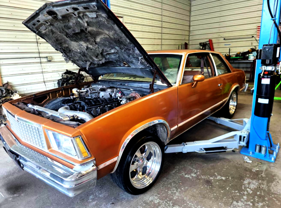 Classic car in mechanic shop 2