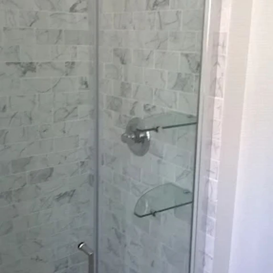 Shower door installation, done by Taurus Contracting of Suffolk County, NY