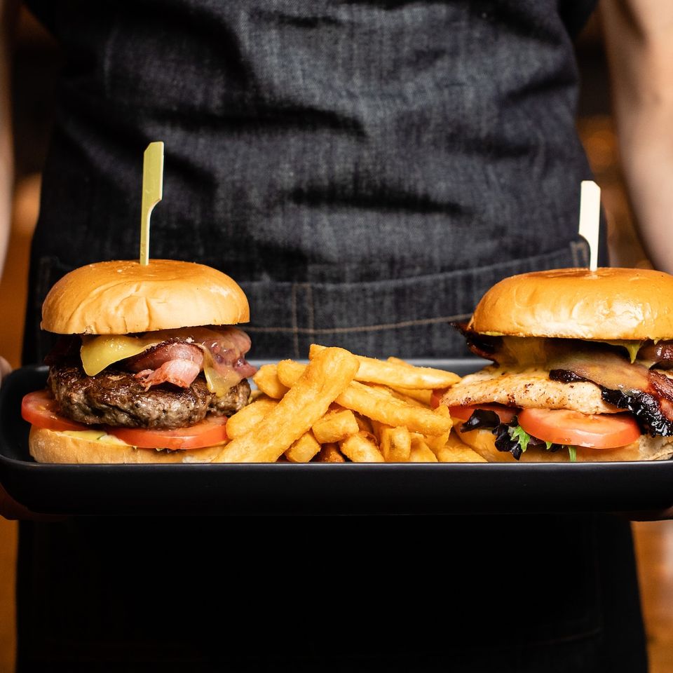 serving cheeseburgers