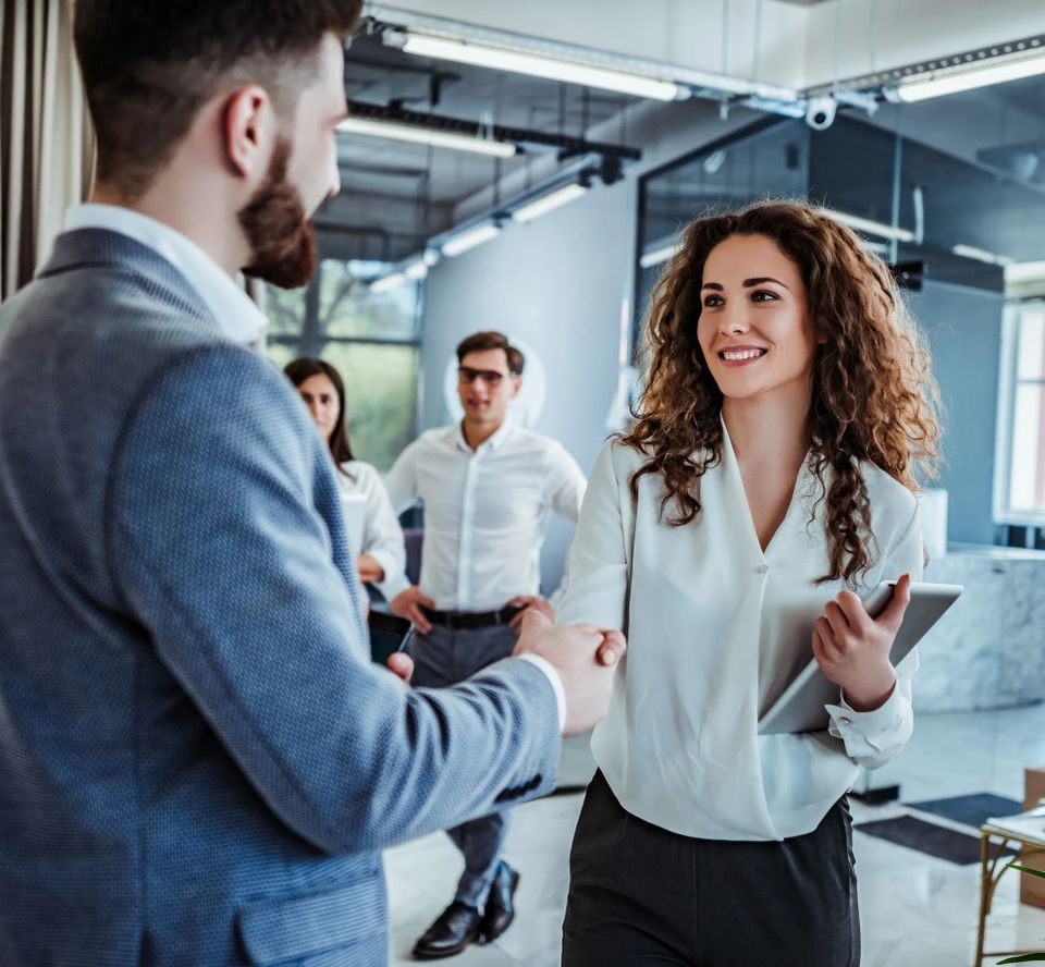 Done Right Website experts shaking hands with a client to signify a successful digital marketing partnership.