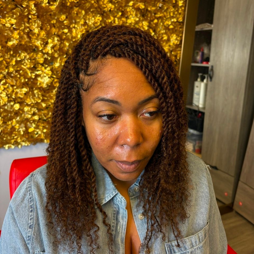 Shoulder length brown Senegalese twists styled on a client in Los Angeles CA