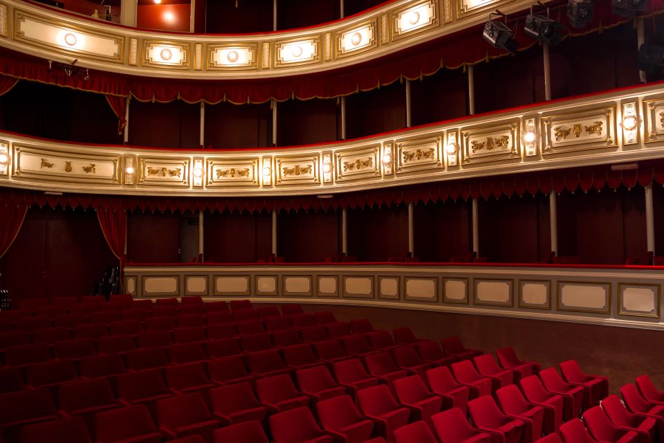 An overview of red seats in an opera theatre 