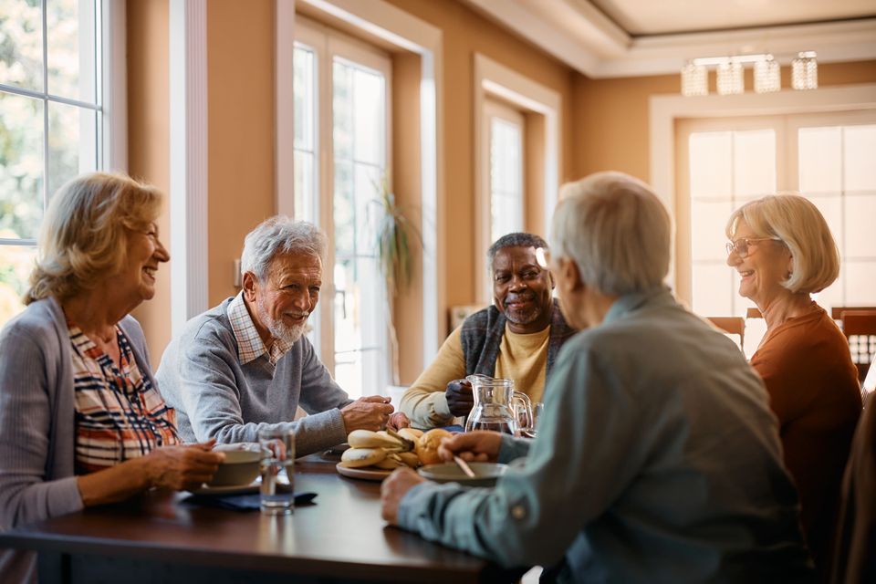 Happy seniors talking while eating lunch at reside 2024 12 13 21 34 29 utc (1)