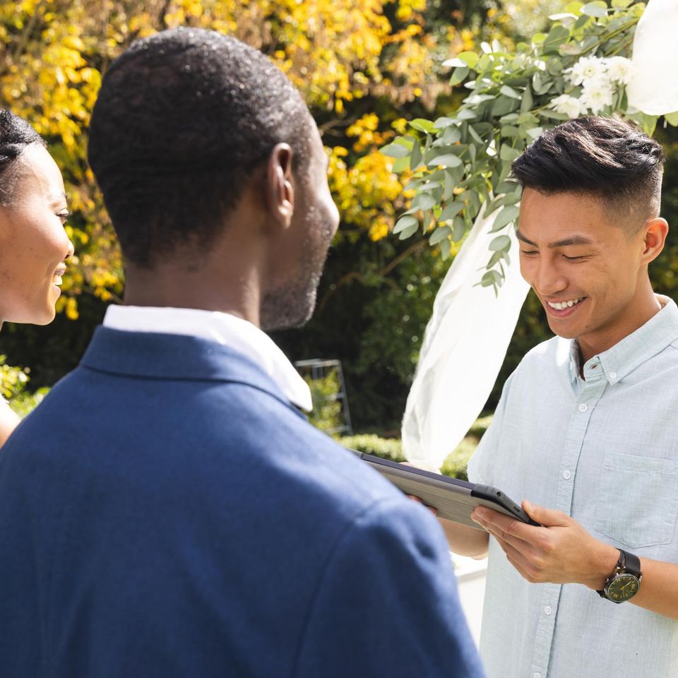Wedding officiant performing custom ceremony for couple