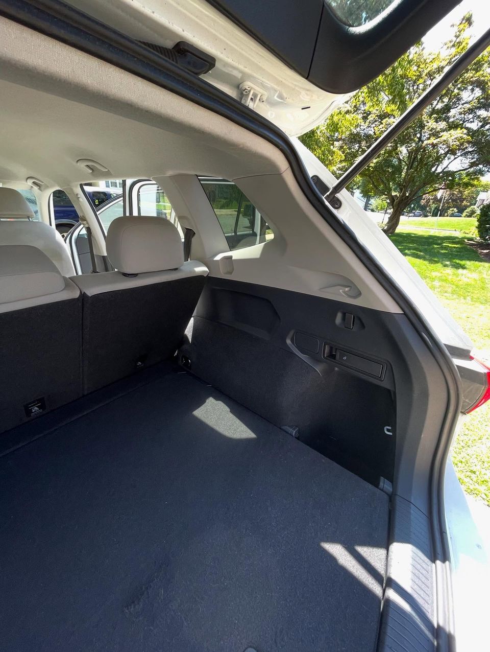Freshly vacuumed SUV cargo floor and side panels after an interior cleaning