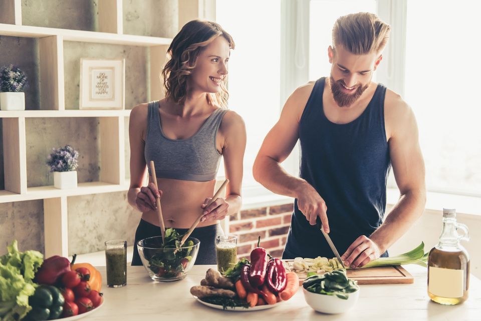 Fit couple preparing a healthy meal