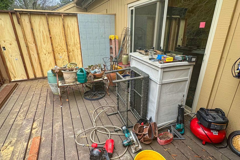 Deck clutter before debris removal by Ultimate Hauling in Placer County California