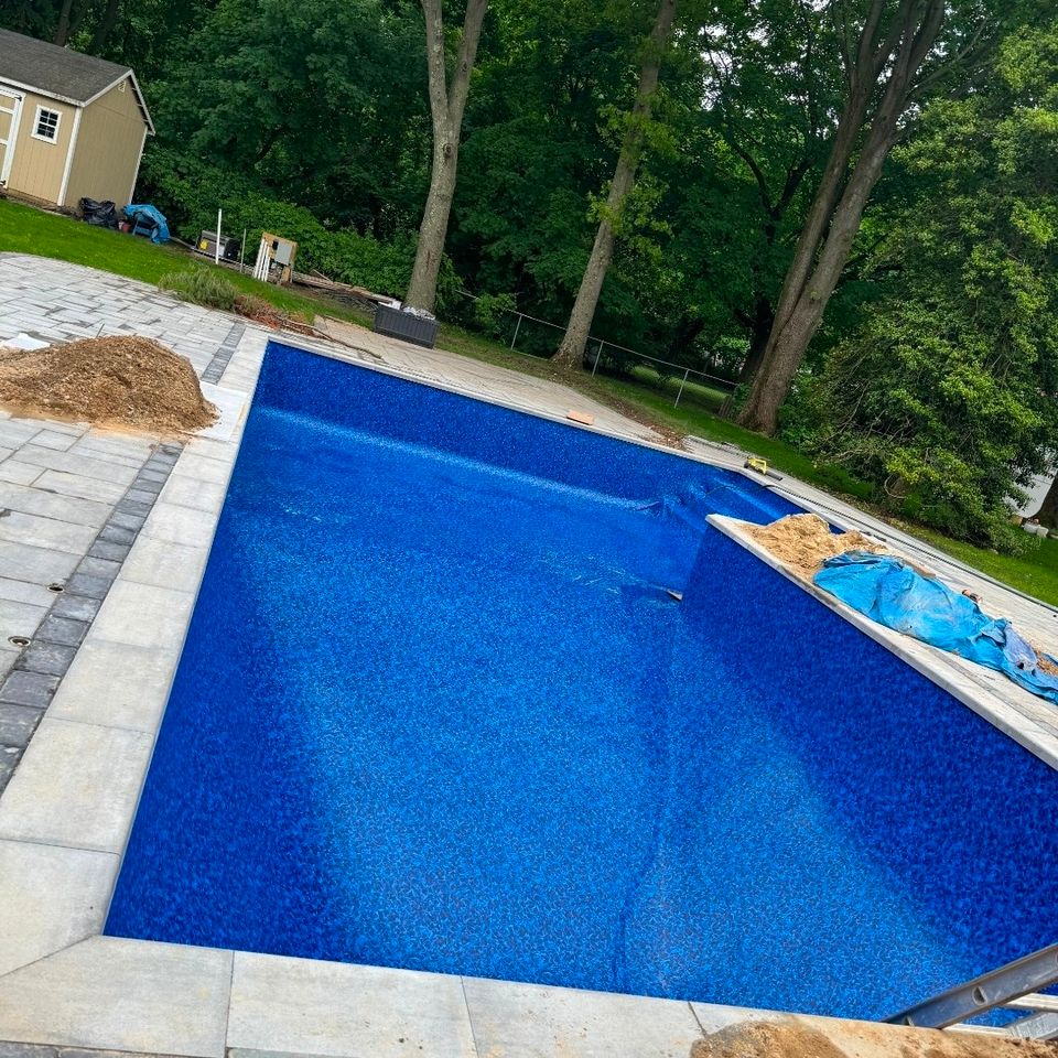 Rectangular inground pool with new liner and bluestone coping during a Long Island pool renovation