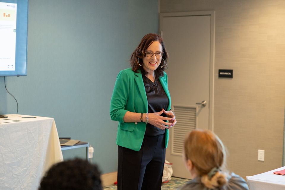 Woman standing speaking to group