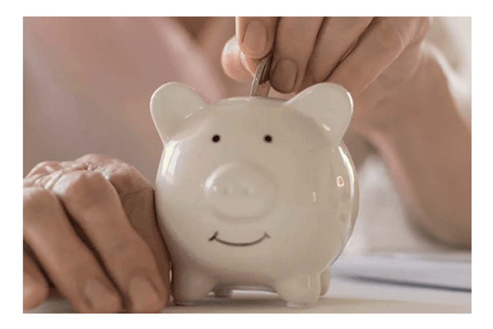 Putting coin in piggy bank3
