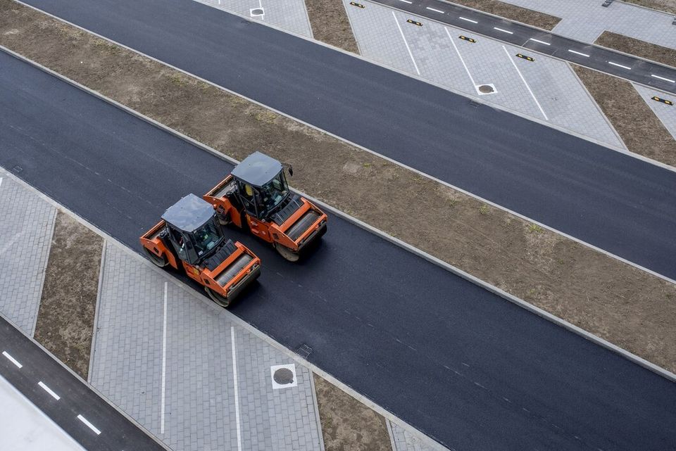 Aerial view orange vibratory asphalt roller compactor new pavement 181624 49122