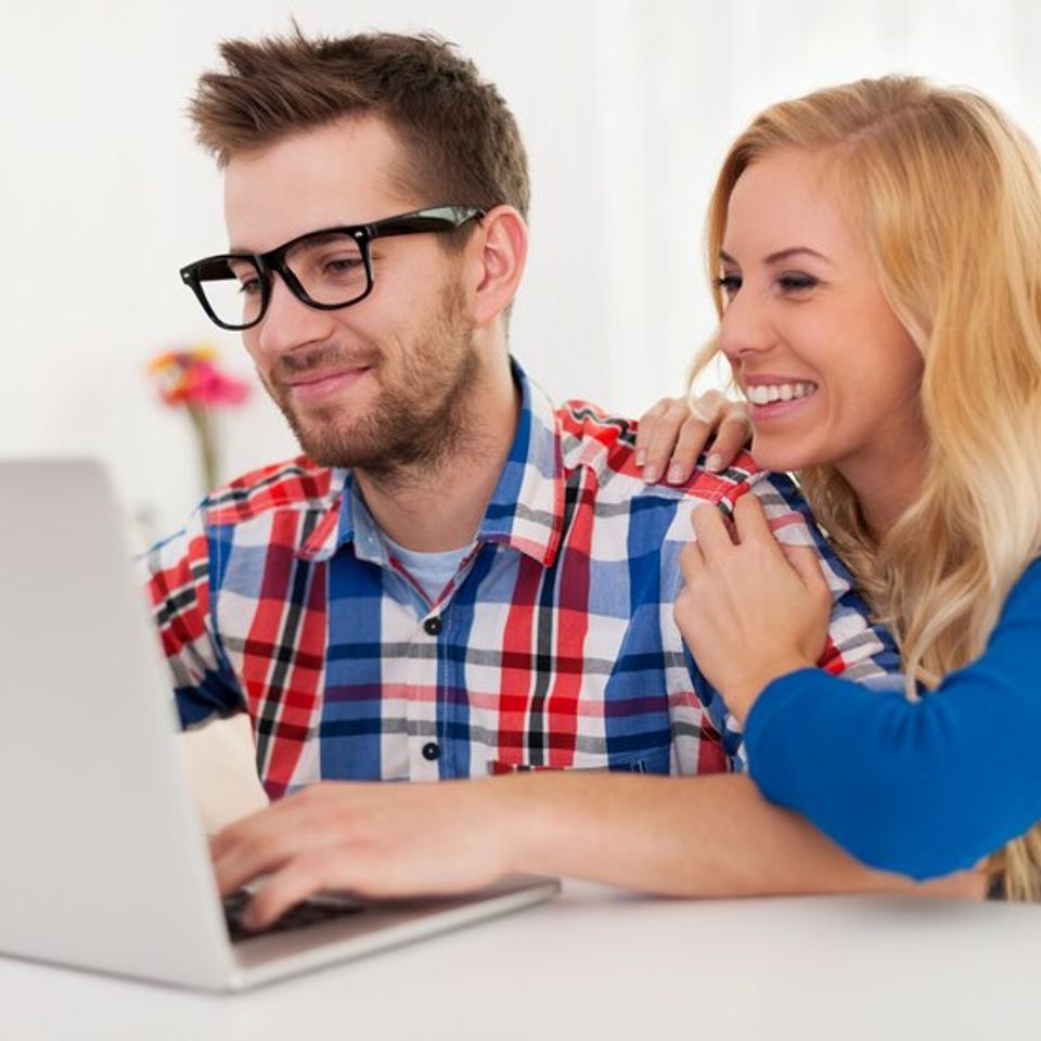 Happy couple browsing something laptop 329181 791