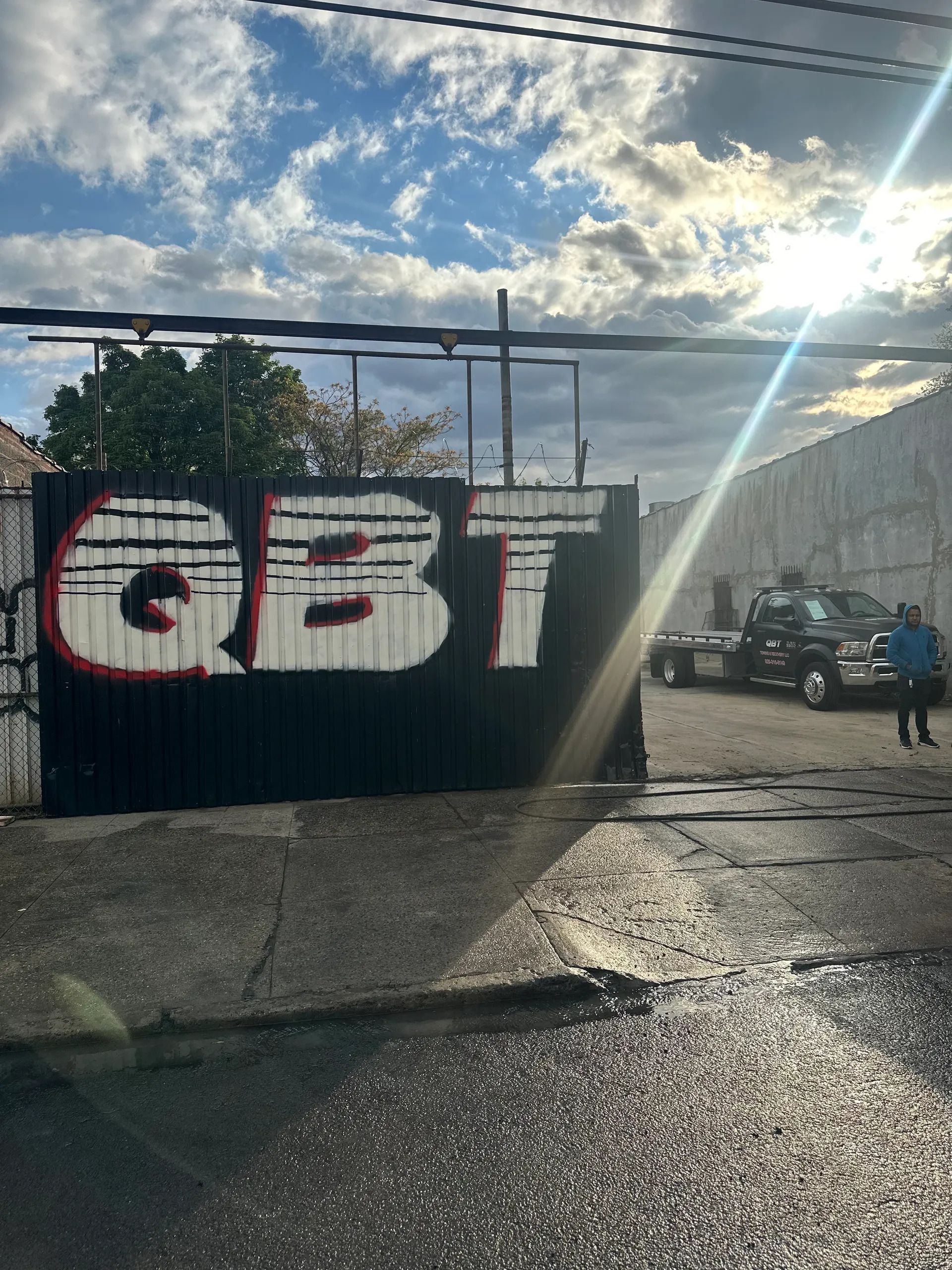QBT yard in Jamaica, Queens with the QBT sign and tow trucks