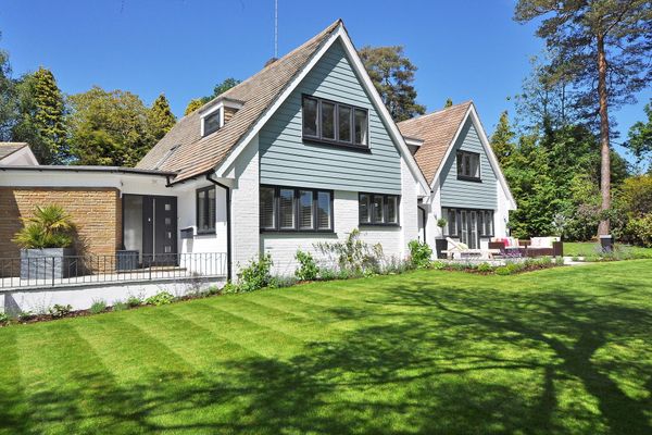 Residential front yard with manicured lawn and landscape