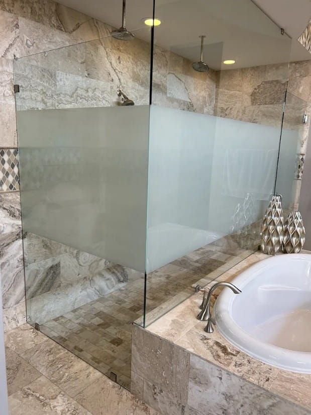 Frosted decorative window film applied to residential shower in Sugar Land, TX for enhanced privacy and style.