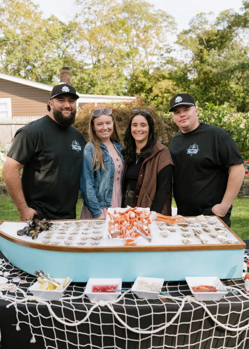 The owners of Shore2Shore Shucking with their wives
