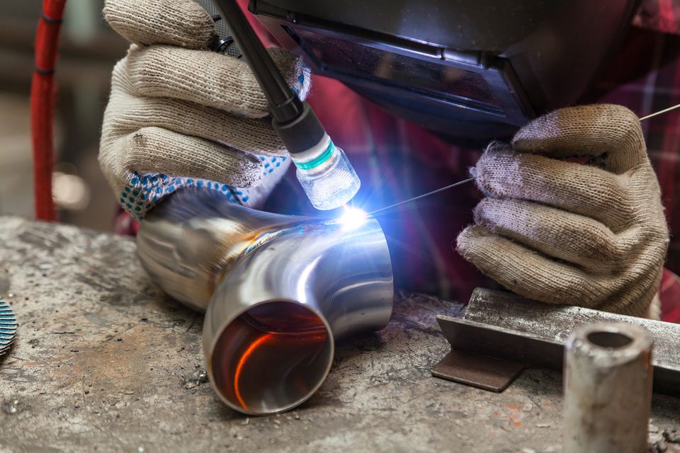 Bigstock young guy welder in a checkere 322344256
