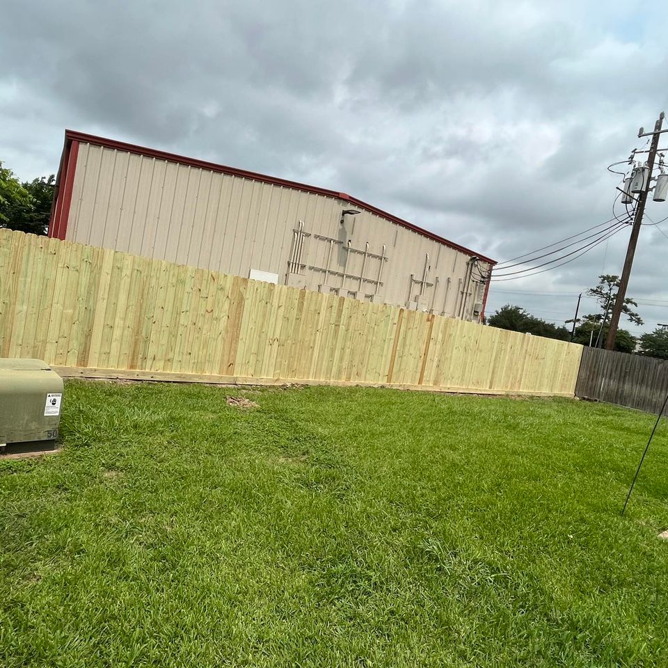 Custom wood fencing installed by Houston welder Marquez Welding