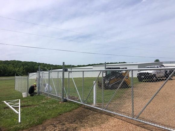 Dore family installing chain link automatic gate