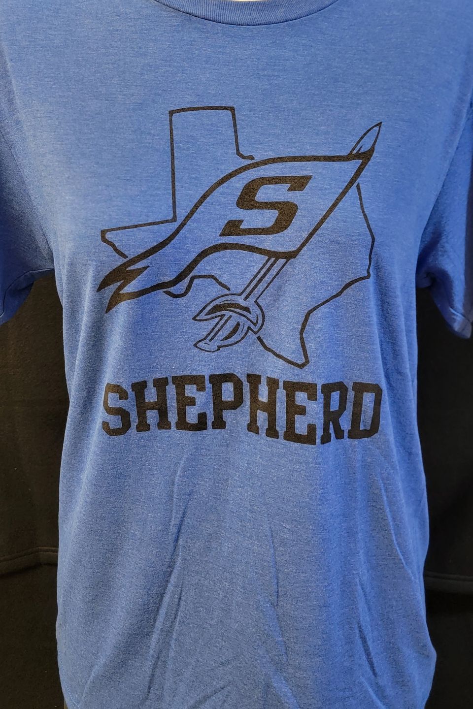 Example of Direct to Film (DTF) - Shepherd High School name and logo on blue t-shirt.