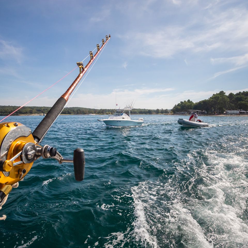 Shot of fishing boats sailing on the ocean waves u 2023 11 27 04 50 31 utc