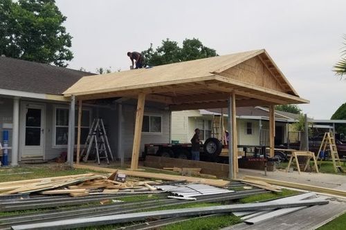 Plywood sheathing fastened to new carport roof in Galveston, TX