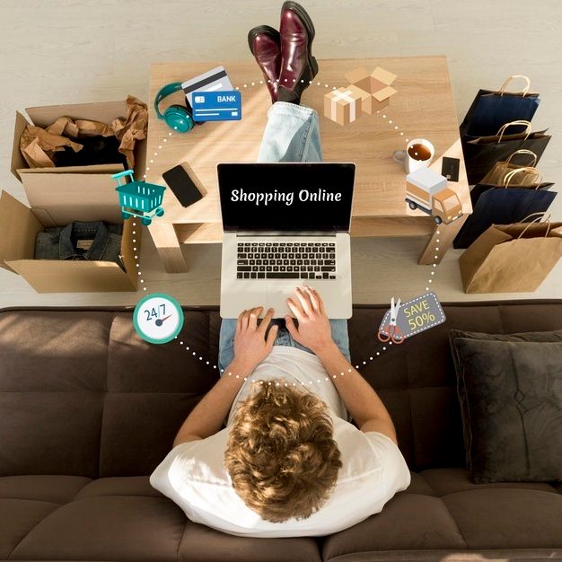 Vista superior hombre haciendo compras linea su computadora portatil 23 2148628111 (2)
