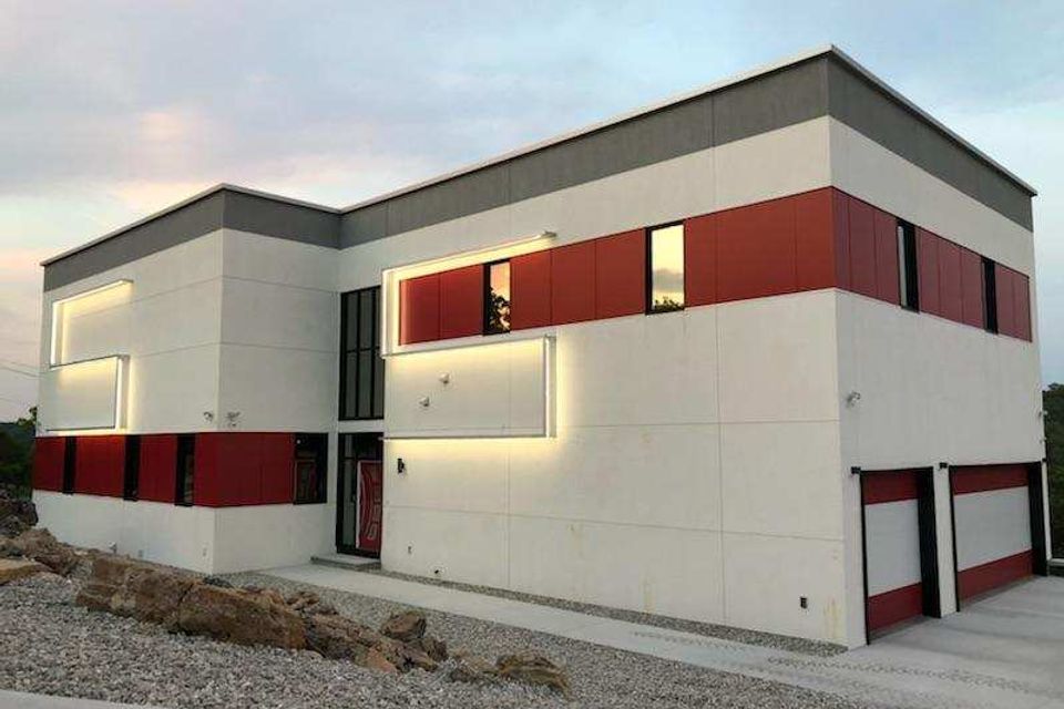 Symphony house front view of exterior with lighted s 