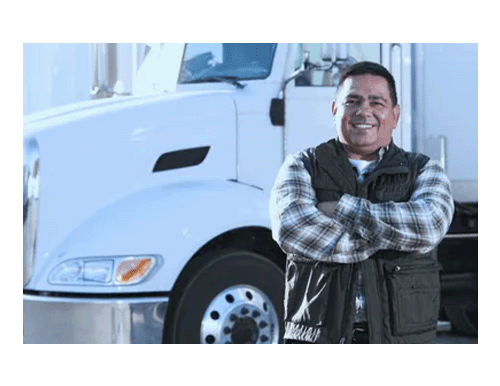 Truck driver standing in front of semi