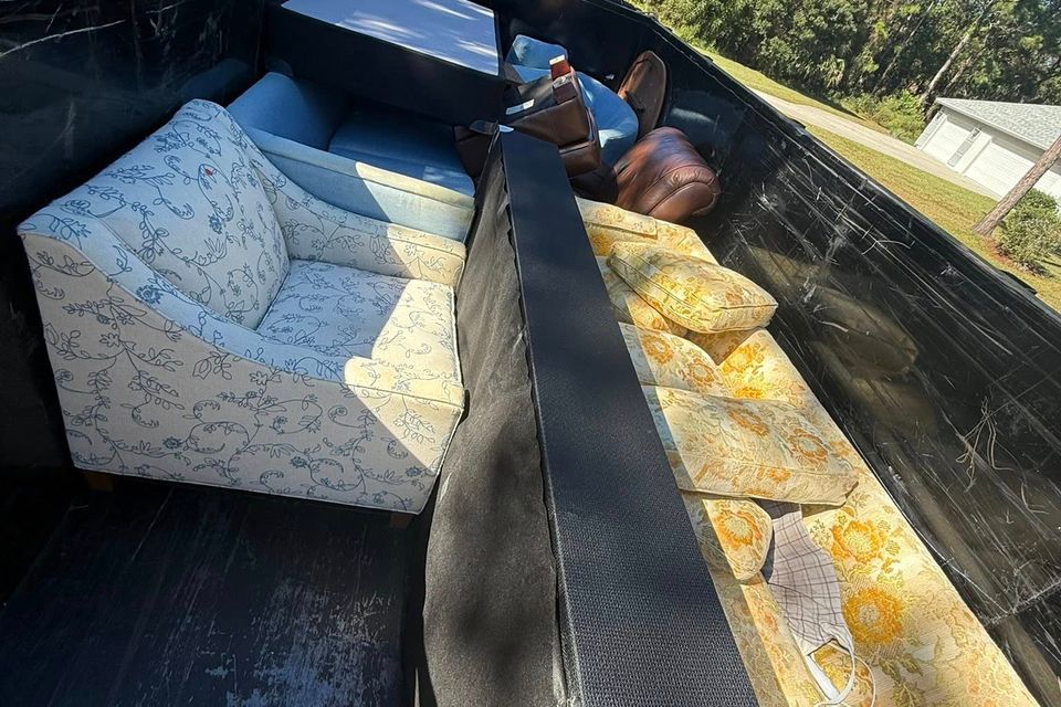 Furniture in the back of the JNJ Hauling Solutions truck