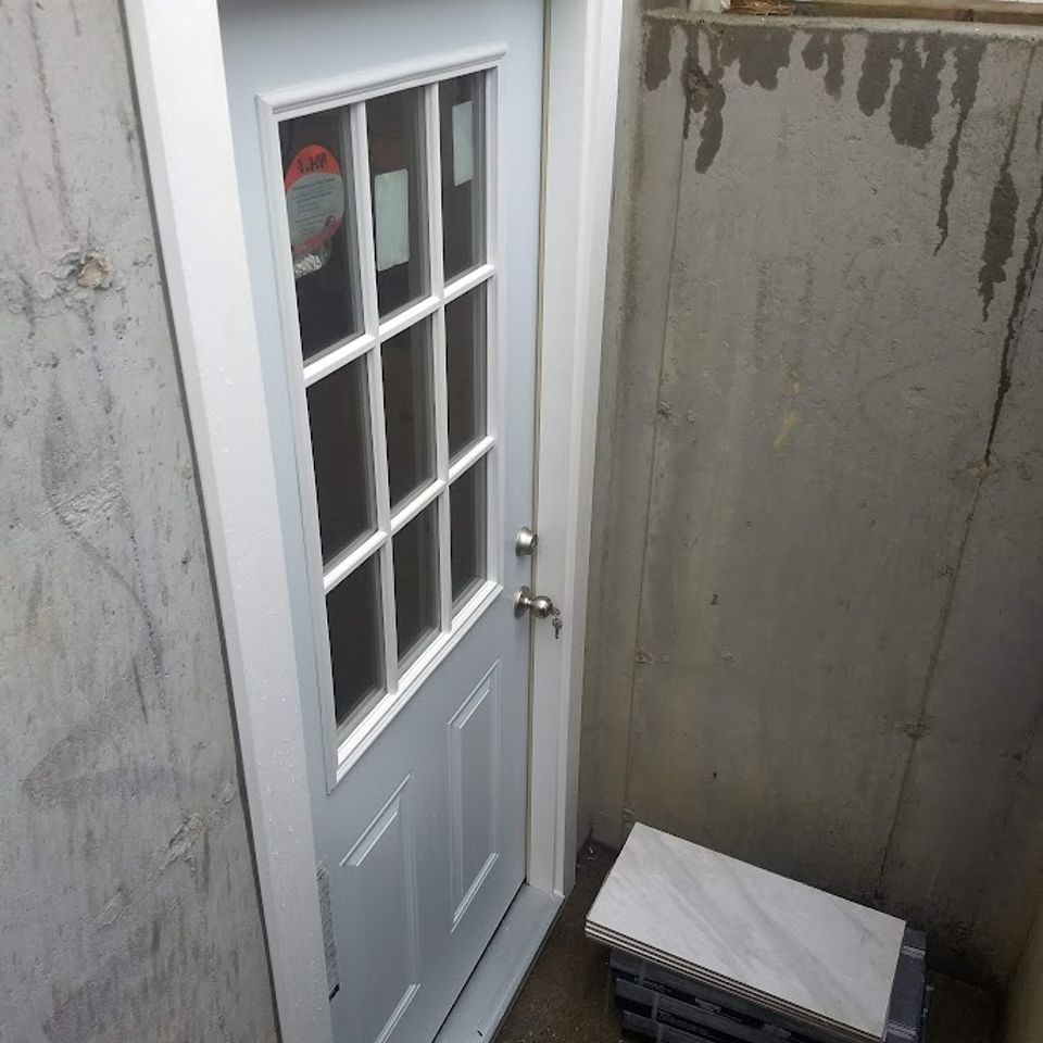 Door installment leading from backyard, done by Taurus Contracting Inc., of Suffolk County NY