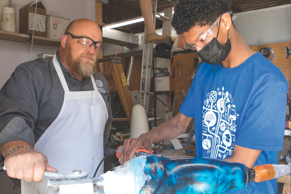 Future School Junior, Jaylin Acevedo (right), interns on Wednesdays at Snell Prosthetics, exploring his interests in medicine and engineering. Photo courtesy Future School of Fort Smith.