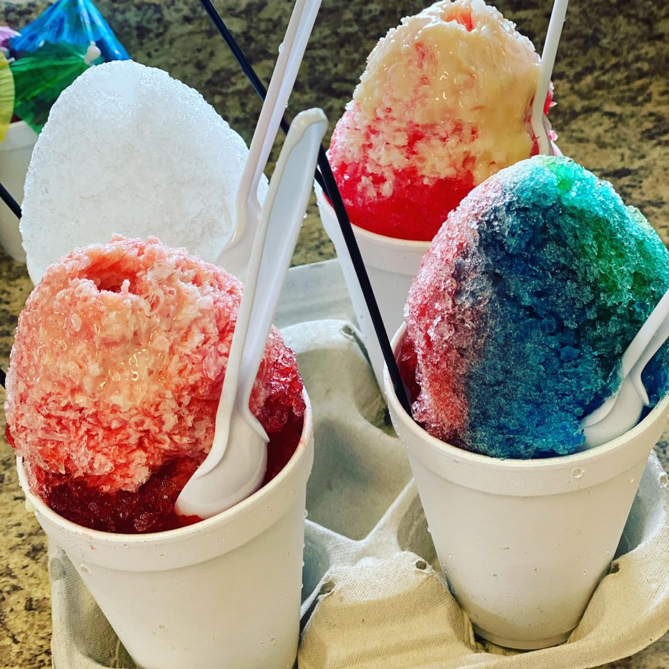 Tray of four colorful snowballs at Bella Boo Ice Cream and Snowballs in Lakeview