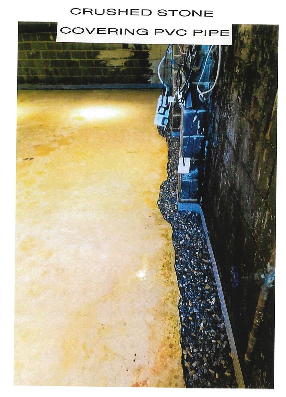 Bone dry crushed stone covering pvc pipe