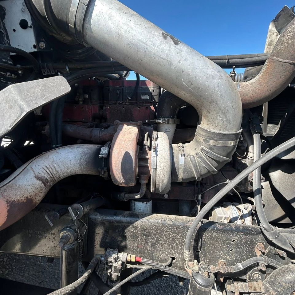 Cummins diesel engine turbocharger and intake piping during semi-truck repair in Arab Alabama