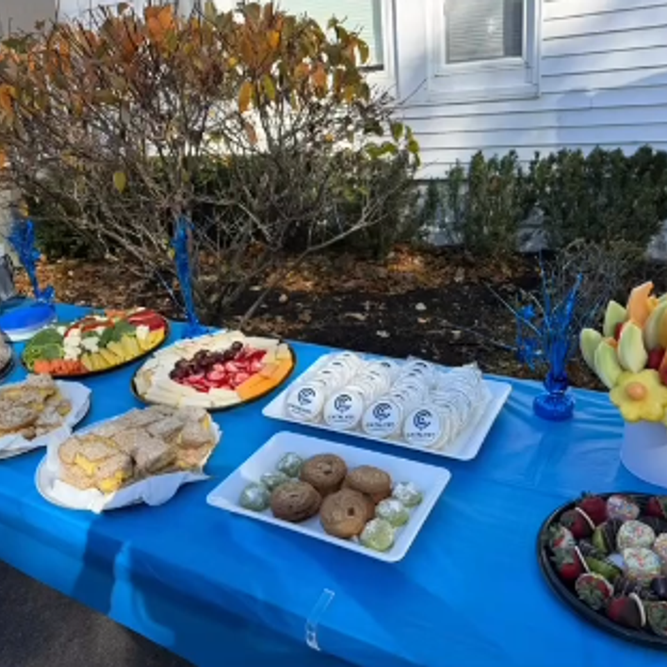 alt="The Party Savers staff bartending and waitressing at a Halloween-themed event"