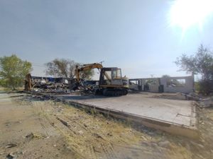 Image of house demolition and concrete removal in progress