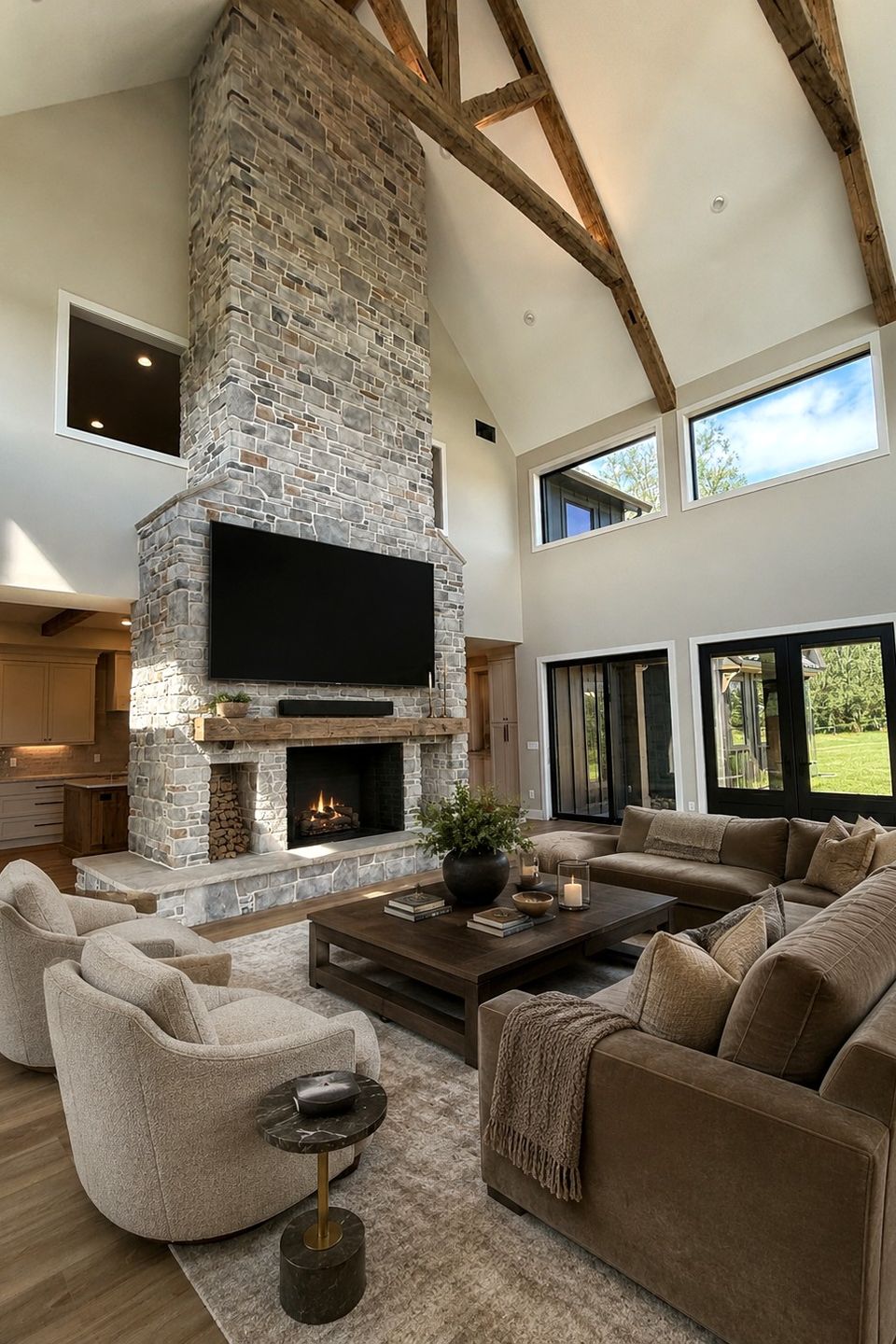 Great room renovation with floor-to-ceiling stone fireplace in Chagrin Falls