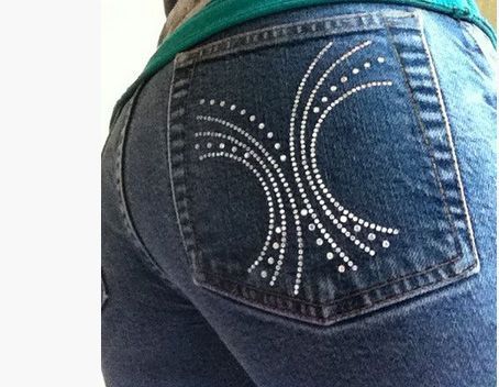 Rhinestone Bling design on back pocket of woman wearing jeans