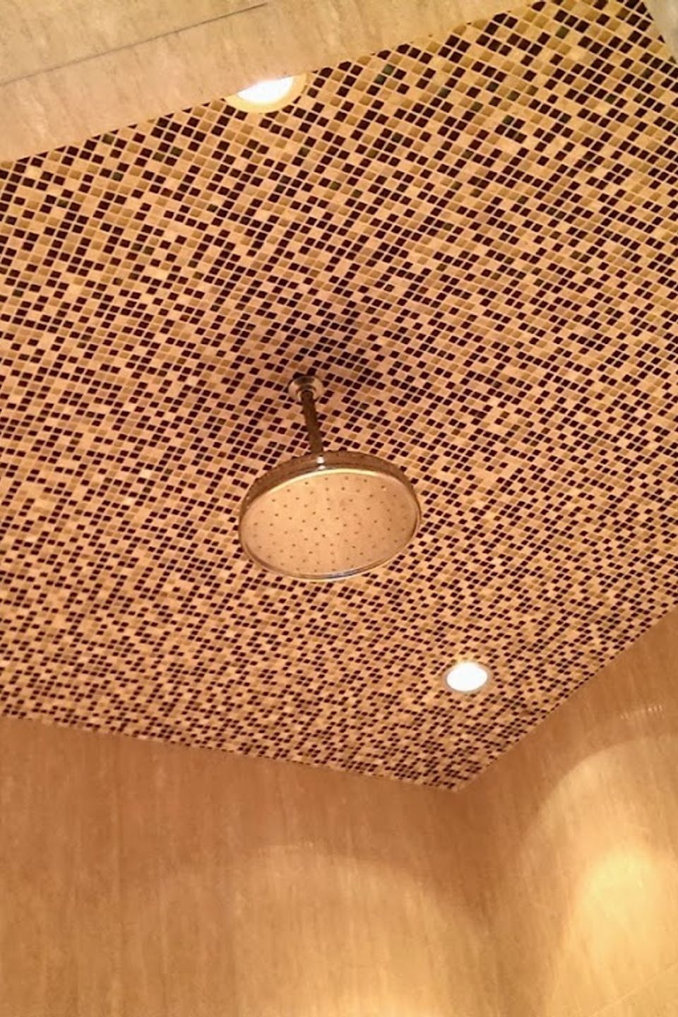 Luxury walk-in shower featuring a custom multi-toned mosaic tile ceiling and premium rain shower head—Artisan tile installation and stone masonry for Sacramento master bathrooms by LuXe Design Tile and Granite inc