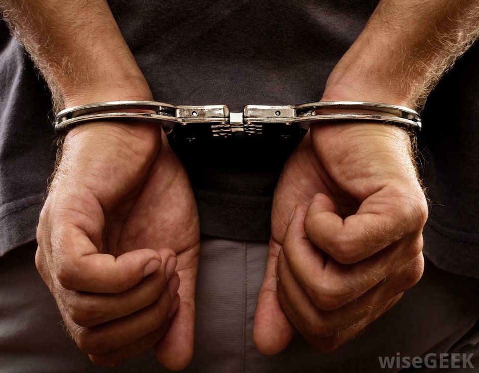 Man handcuffed behind the back