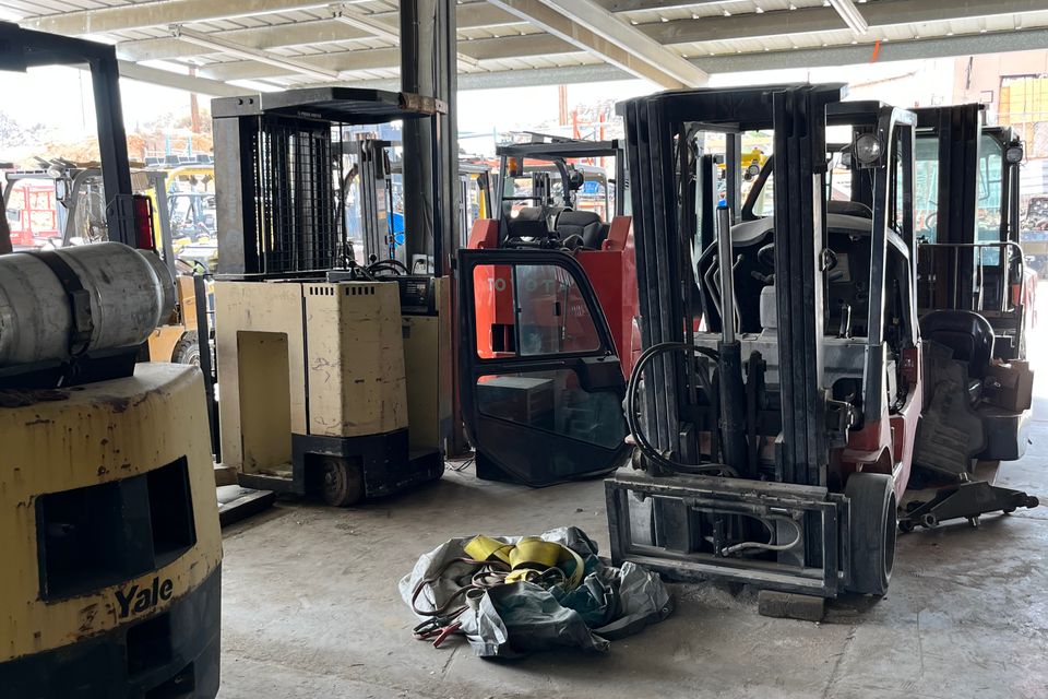 Image of forklifts waiting for a forklift technician to begin the repair