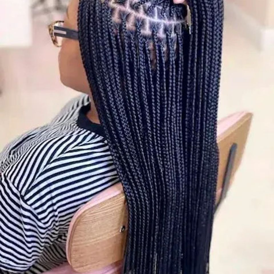 Long neat knotless box braids with clean parts after a braiding service in Los Angeles CA