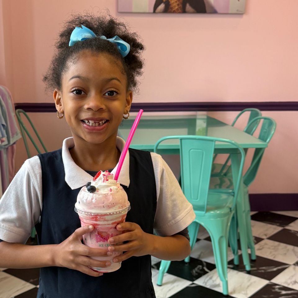 Young girl enjoying a Pothole in her school uniform.