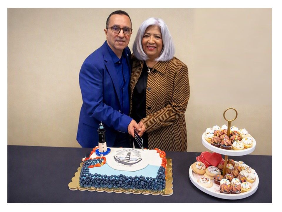 Manny & olivia cutting anniversary cake at the holiday inn