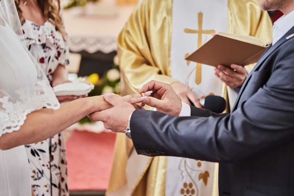 Religious wedding ceremony with couple exchanging vows in a spiritual setting in Bronx, NY