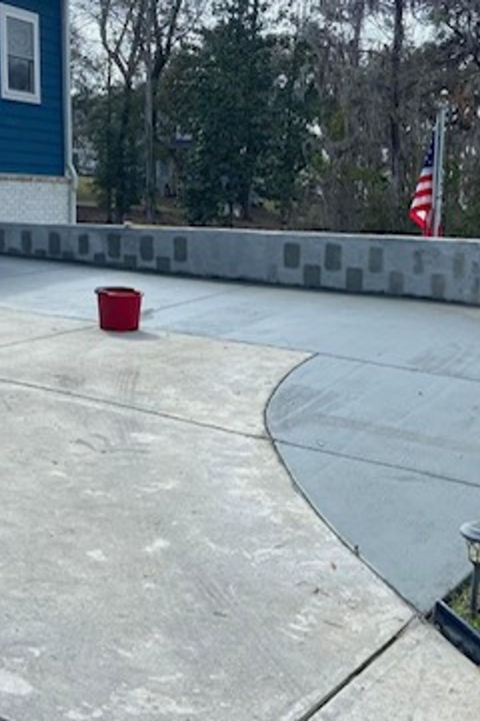 "Concrete driveway professionally constructed by Gabino Landscaping in Myrtle Beach, South Carolina."
