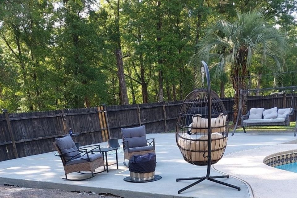 Cocnrete army patio around pool